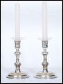 A pair of stunning contemporary J A Campbell silver hallmarked turned ( filled ) candle sticks