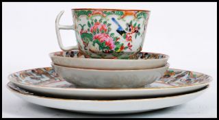 A 19th century Oriental Chinese porcelain cup decorated in poly chrome colours along with four