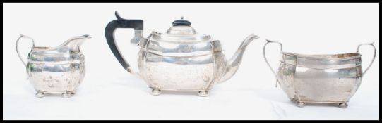 A silver hallmarked 3 piece tea service comprising teapot, sugar pot and creamer. Hallmarked for