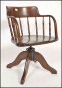A stunning early 20th century Industrial captains office swivel desk chair. Raised on quadruped base