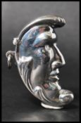 A  silver vesta case in the form of a crescent moon. Weight 17g. Measures approx 5cms.