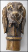 An early 20th century bronze walking stick handle in the form of a hunting setter dog.