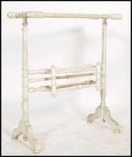 A Victorian painted pine shabby chic towel rail. The towel rail of turned construction having