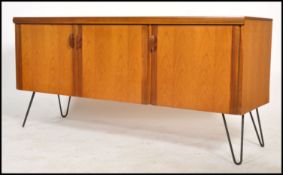 A superb vintage  mid century teak wood sideboard in the Danish manner having contrasting edge
