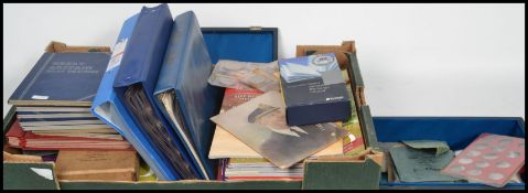 Coins; a collection of assorted coins, along with various empty coin collectors albums and related