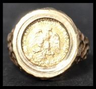 A hallmarked 9ct gold ring with Mexican 2 peso 1945 coin Estados Unido Mexicano. The inset coin