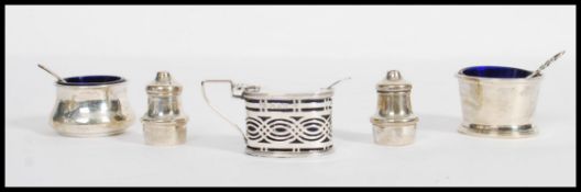 A collection of silver hallmarked table cruets, to include a pair of cruets by Neustadt &