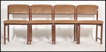 A set of 4 retro 20th century Danish influenced teak wood dining chairs, Raised on squared legs with