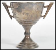 A hallmarked silver trophy cup by Vaughton & Sons bearing assay marks for Birmingham dating to 1937.