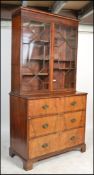 A Georgian 18th / 19th century mahogany secretaire bureau bookcase on chest. Raised on bracket