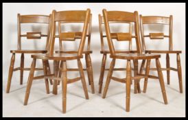 A set of 6 antique style oxford bar back windsor dining chairs raised on turned legs with panel