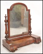 A 19th century mahogany dressing table swing mirror in the manner of Gillows. Raised on a shaped