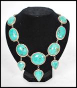 A silver 925 large turquoise adorned choker necklace of art nouveau style set to a hoop link chain