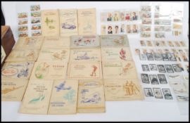 A collection of vintage 20th century cigarette cards to include Anstie Downland horse racing