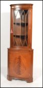 An antique  Georgian style mahogany corner display cabinet with cupboard under astragal glazed