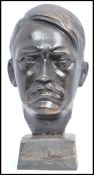 A modern cast iron bust, modelled in the form of Adolf Hitler, on a square base, unsigned, 20cm