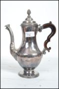 An 18th century George III silver plated coffee pot in the manner of Hester Bateman. Baluster form