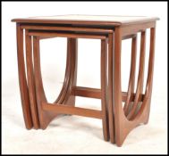 A 1970's G-Plan ' Astro ' teak wood nest of tables. The tables of graduating form with each being