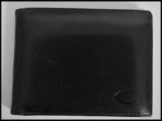A 20th century Alfred Dunhill full leather black gentleman's wallet, opening to reveal sectioned for