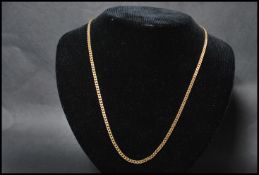 An 18ct gold curb link necklace chain having a bolt ring clasp. Measures 20 inches long weighs 11