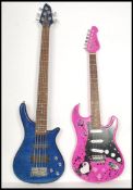 Two vintage electric six sting guitars. One being a blue example with shaped body the other being