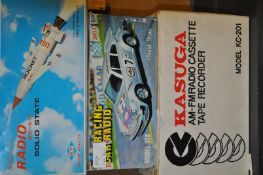 A group of three vintage boxed radios to include a Kasuga KC-201 an Solid State rocket radio, and