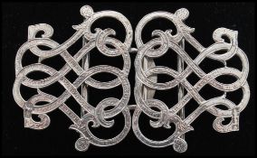 A pair of silver hallmarked scroll work Nurses buckles, Birmingham assay mark, date letter K (