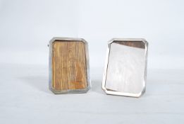A pair of silver hallmarked easel backed picture frames marked for Birmingham 1945 by makers B&M