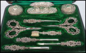A Victorian silver hallmarked Art Nouveau ladies necessaire vanity manicure set by Levi & Salaman.