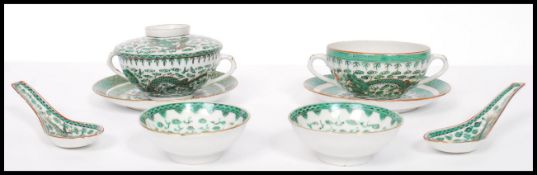 A vintage 20th century Chinese ceramic rice set consisting of rice bowls and cover, side plates