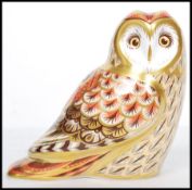 A Royal Crown Derby paperweight, Short Eared Owl gold stopper, red stamp to base dated mark for 2008