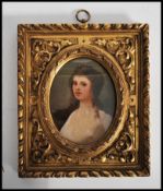 Henry Woods, RA (British, 1846-1921), A 19th century miniature oil painting of a young lady in a