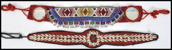 Two vintage South American vintage 20th century bead and shell worked work belts, one with oval
