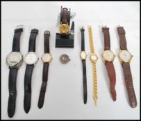 A collection of ladies and gents vintage 20th century watches to include watches by Curtiss,