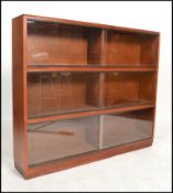 A vintage 20th century mahogany lawyers stacking bookcase cabinet of sectional form with glass facia