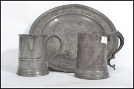 A group of 19th century pewter metal ware to include a VR stamped with side handle and