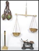 A set of vintage 20th century brass balance scales together with a pair of fishermans glass buoys