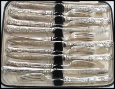 A 19th century Victorian silver hallmarked six person knife and fork set consisting of six silver