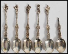 A set of 6 silver  hallmarked apostle tea spoons by Charles Stuart Harris, London 1884. One af.