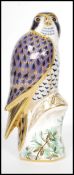 A Royal Crown Derby Peregrine Falcon paperweight, with red stamp to underside, dated 2008 and gold