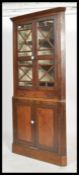 A 19th century country house Fruitwood corner unit display cabinet having astral glazed doors with