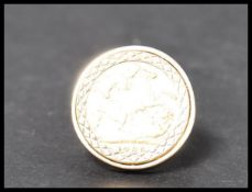 A half sovereign ring in 9ct gold oversized shank. The sovereign marked for 1903 with Edward VIII