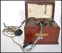 A Geocophone crystal wireless wooden cased set, instructions sheet still attached to the underside