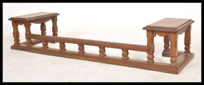 A 19th century solid country oak club fire fender. The kerb with plinth base and top, gallery to
