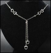 A 925 silver necklace in the style of a watch chain having stirrup links and lobster claw clasp.
