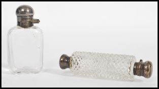 A silver and cut glass double ended perfume phial along with another silver topped perfume scent