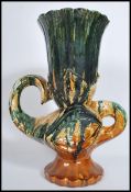 An unusual mid century retro Fat Lava style twin handled abstract majolica vase. Dripglaze colourway