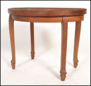 An unusual early 20th century Chinese carved side table. Raised on shaped legs with oval table top