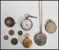 A continental silver 800 pocket watch along with a gold tone metal sovereign holder a Victorian 1887