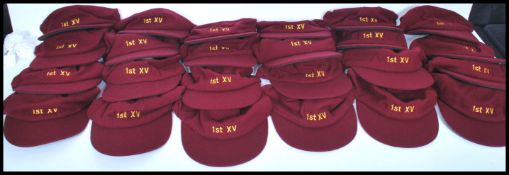 A set of 24 vintage rugby sporting caps of matching form with embroidered numbers having plain